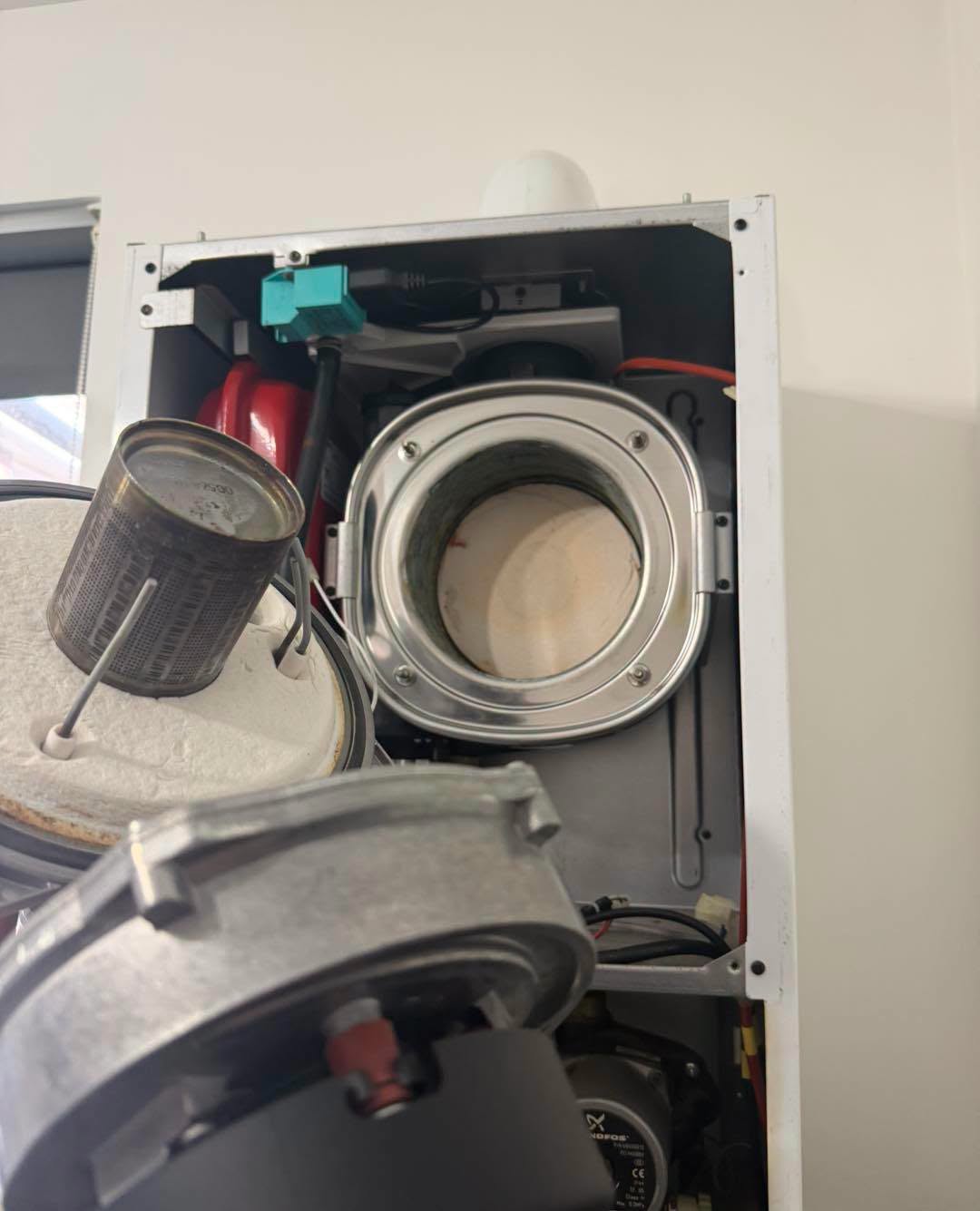 Open case, burner and fan in view.