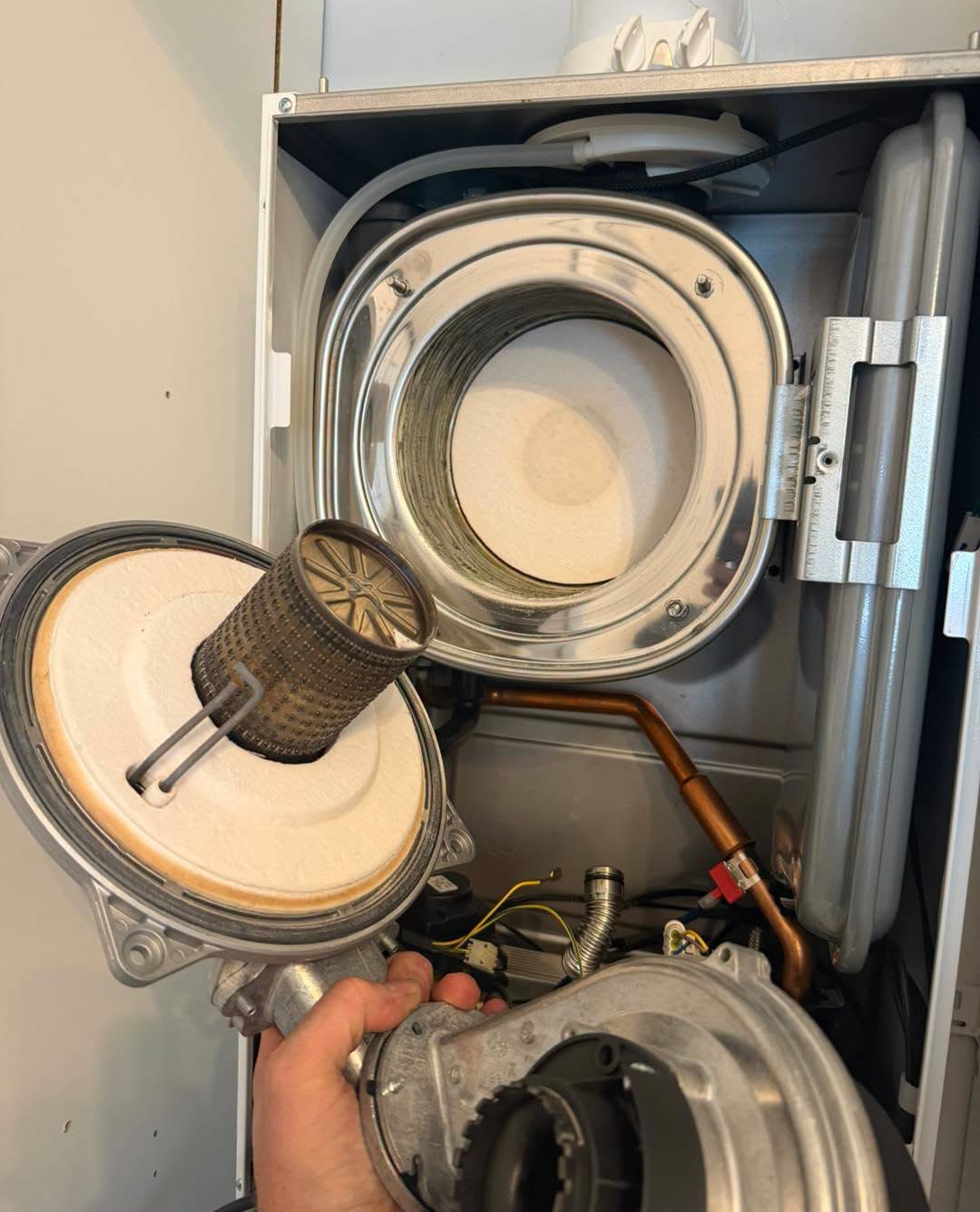 Boiler burner and fan removed during a service