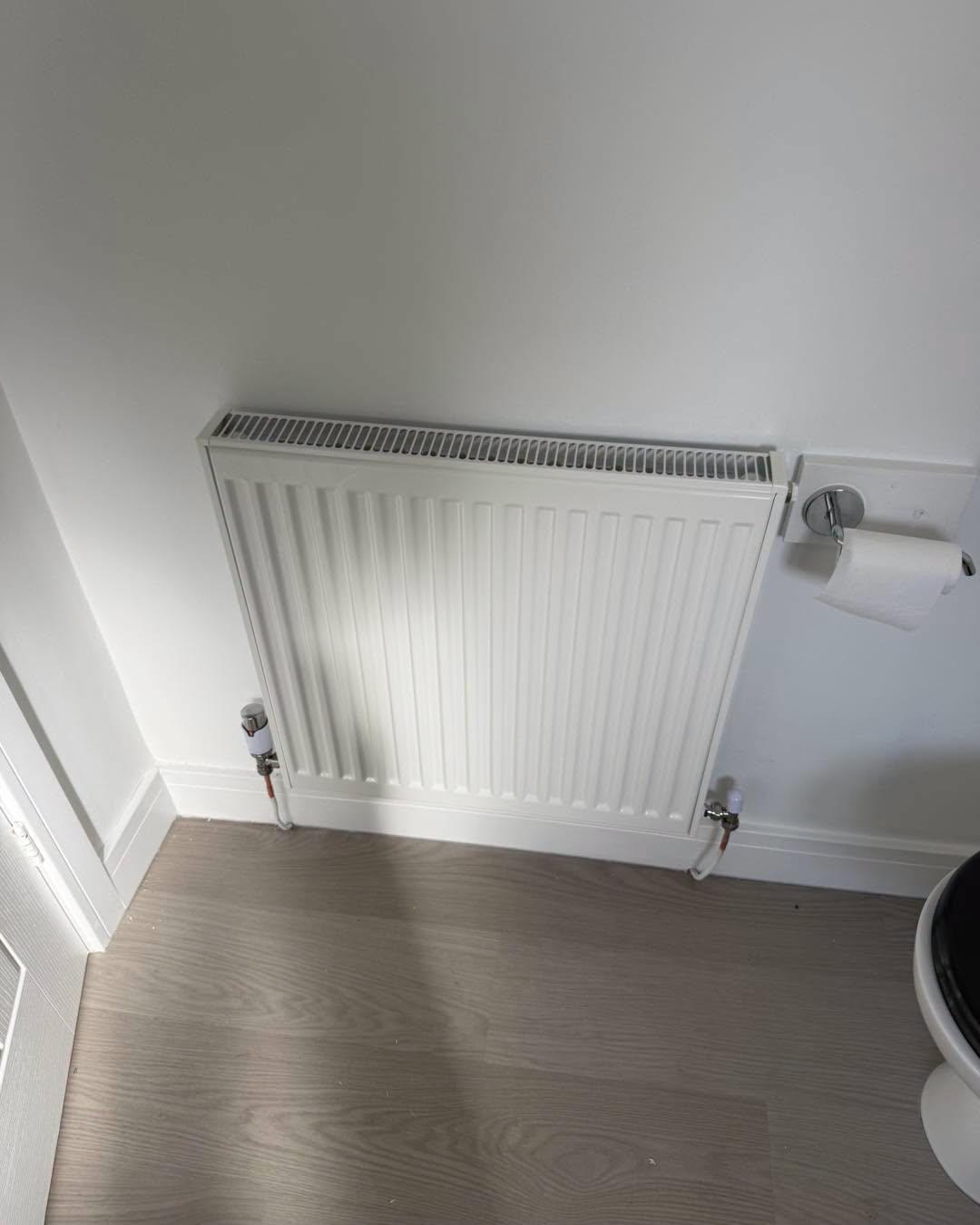 Radiator fitted in a cloakroom.